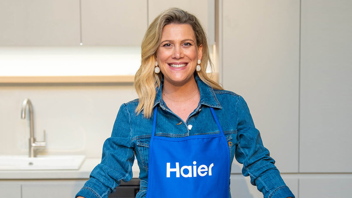 Justine Schofield wearing a Haier branded apron.